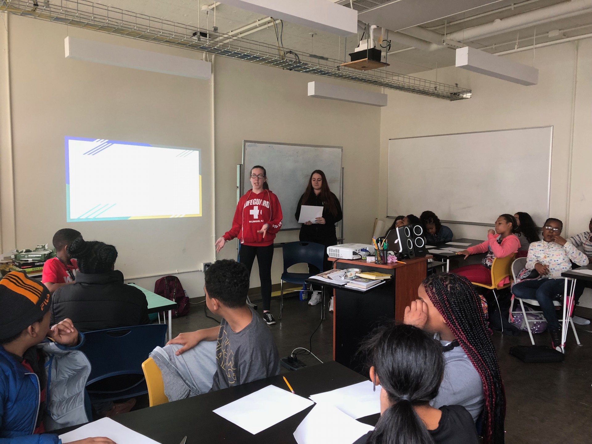 Stephanie & Mercedes teaching Ms.Hamilton’s class at Science Leadership Academy Middle School an origami lesson.